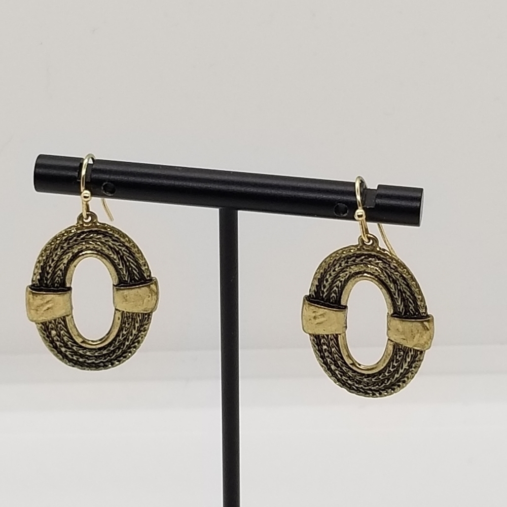 gold tone oval dangle earrings ropelike with cutout
